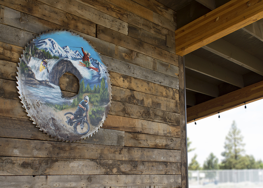 A custom art installation: scenes of central Oregon today hand-painted on the industrial sawmill tools of yesterday